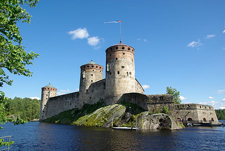 gray castle and body of water during daytime thumbnail