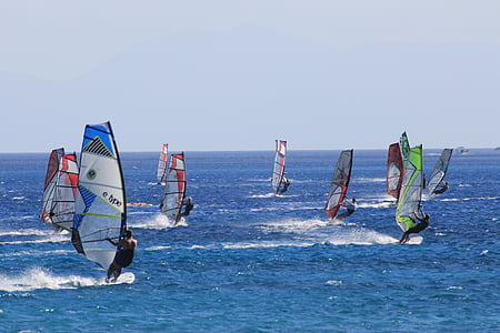 group of people parasailing on body of water thumbnail