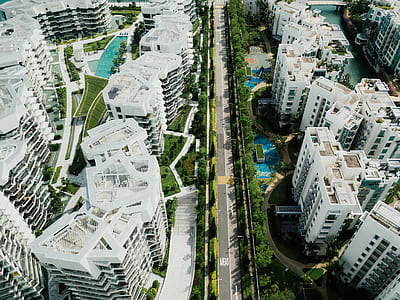 aerial photography of road between white buildings thumbnail