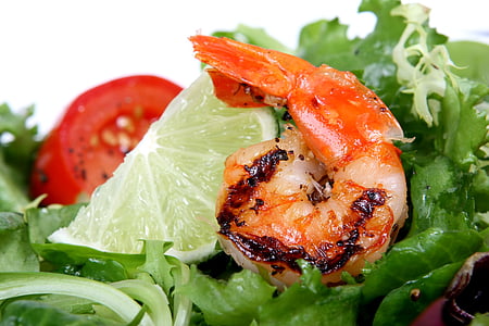 closeup photo of vegetable salad with shrimp and lemon on top thumbnail