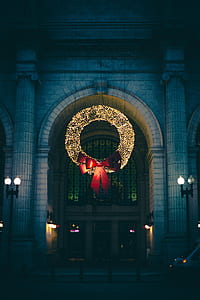 lighted large ribbon wreath in front of building thumbnail