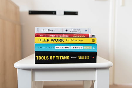 pile of books on white table thumbnail