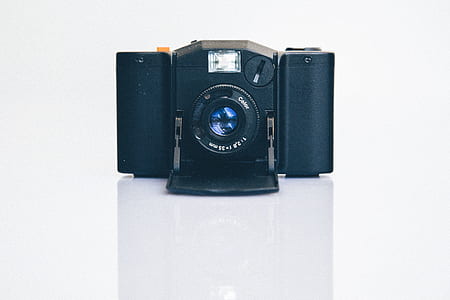 black DSLR camera thumbnail