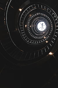 worm's eye view of spiral staircase thumbnail