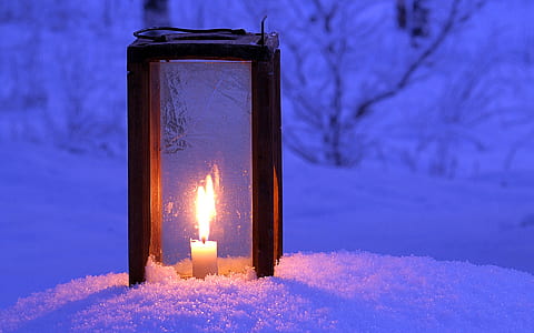 candle lantern on snow thumbnail