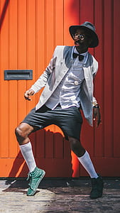 man standing in front of orange container thumbnail