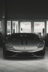 gray Lamborghini Huracan parked inside the building thumbnail