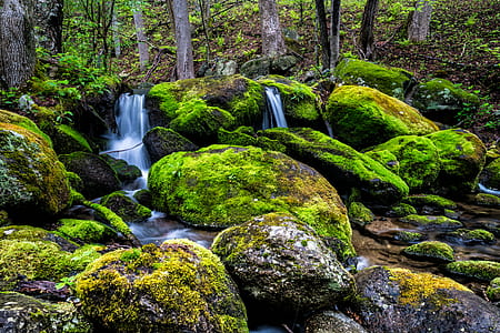 waterfalls surrounded by stones thumbnail