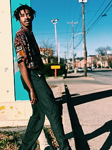 selective focus photography of man at sidewalk thumbnail