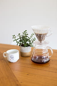 glass coffeepot beside white mug thumbnail