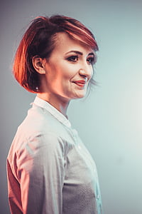 short brown haired woman wearing white collared top thumbnail