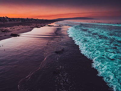 photo of sea wave crashing on seashore thumbnail