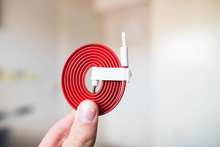 person holding red USB cable thumbnail