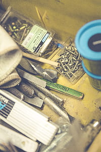 Stainless Steel Screw Near Blue Tin Can thumbnail
