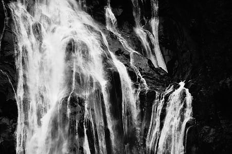 grayscale photography of waterfalls thumbnail