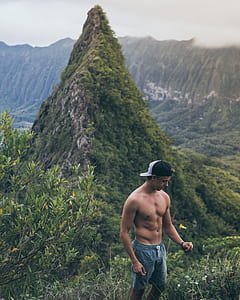 man standing on green grass field thumbnail