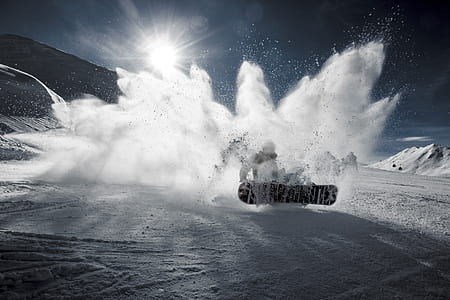 person riding on snowboard in snowfield thumbnail