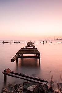 broken dock pier in body of water thumbnail