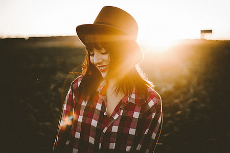 woman standing in grass field thumbnail