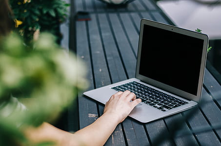 person in front of laptop at daytime thumbnail