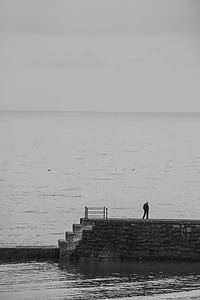 man standing on concrete dock thumbnail