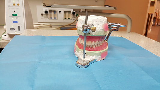 dentures on teal cloth thumbnail
