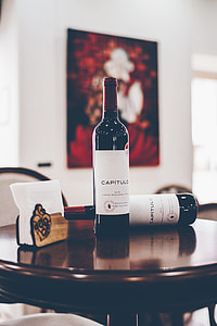 Capitulo wine bottle on brown wooden table thumbnail