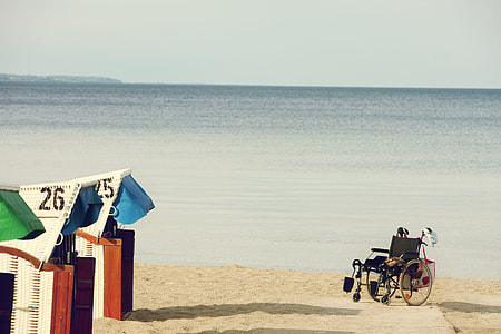 black wheelchair on seashore thumbnail