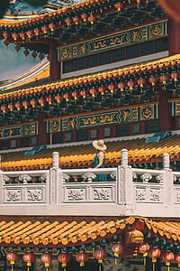 woman in orange and green pagoda thumbnail