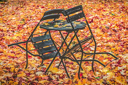 black chair leaning on table thumbnail