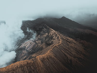 aerial photo of mountain top with fog thumbnail