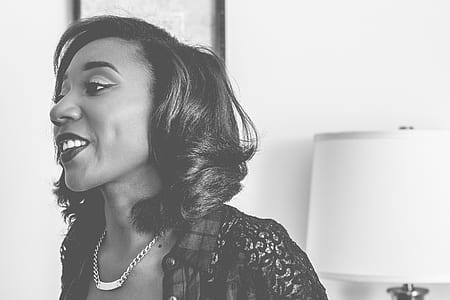 grayscale photo of woman wearing bib necklace thumbnail