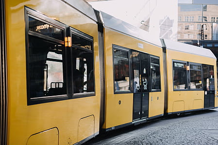 yellow-and-black tram during daytime thumbnail