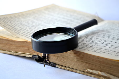 black magnifying glass on book thumbnail