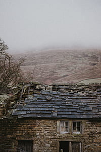 view of gray concrete house thumbnail