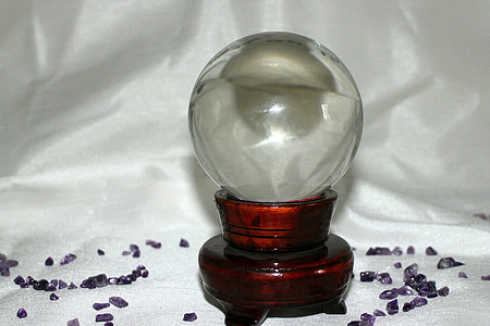 round clear glass ball decor with purple stone on white satin thumbnail