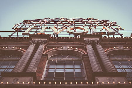 low-angle photography of Tivoli concrete building under cloudy sky thumbnail