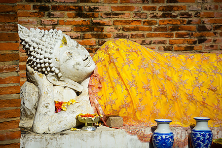 two white-and-blue delft vases near Gautama buddha statue thumbnail