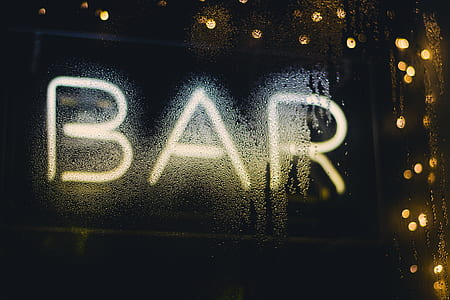 white bar LED signage taken at nighttime thumbnail
