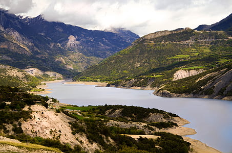 mountain beside body of water thumbnail