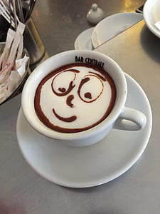 white and brown beverage in white ceramic teacup thumbnail