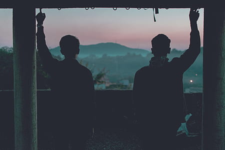 two men standing near each other thumbnail