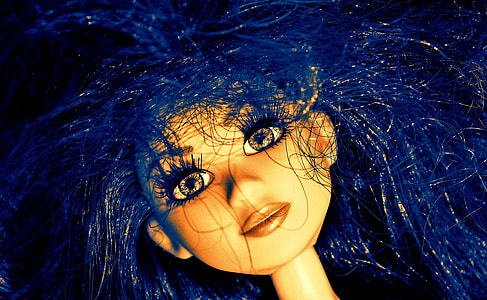 close up photo of doll head with blue hair thumbnail