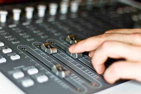 person holding black audio mixer thumbnail