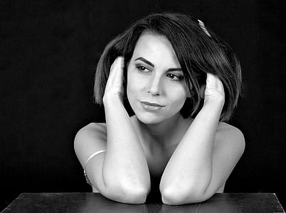 Woman Sitting and Holding Her Hair thumbnail