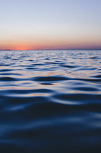 body of water under orange sunset thumbnail