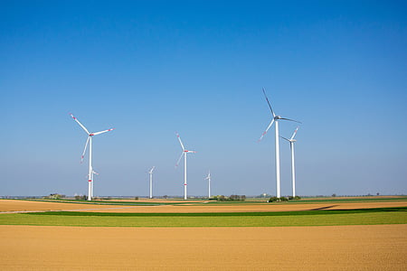 white turbines on green field thumbnail