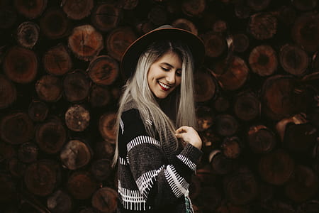 woman wearing white and black cardigan and hat thumbnail