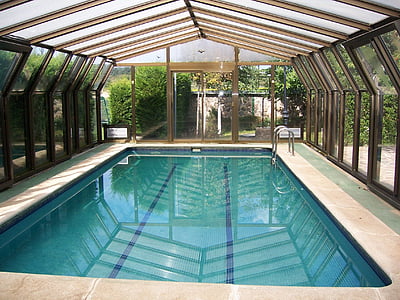 empty indoor swimming pool inside glass roof and wall room thumbnail