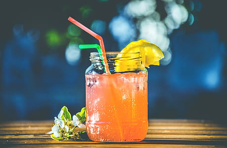 orange plastic straw in clear mason jar thumbnail
